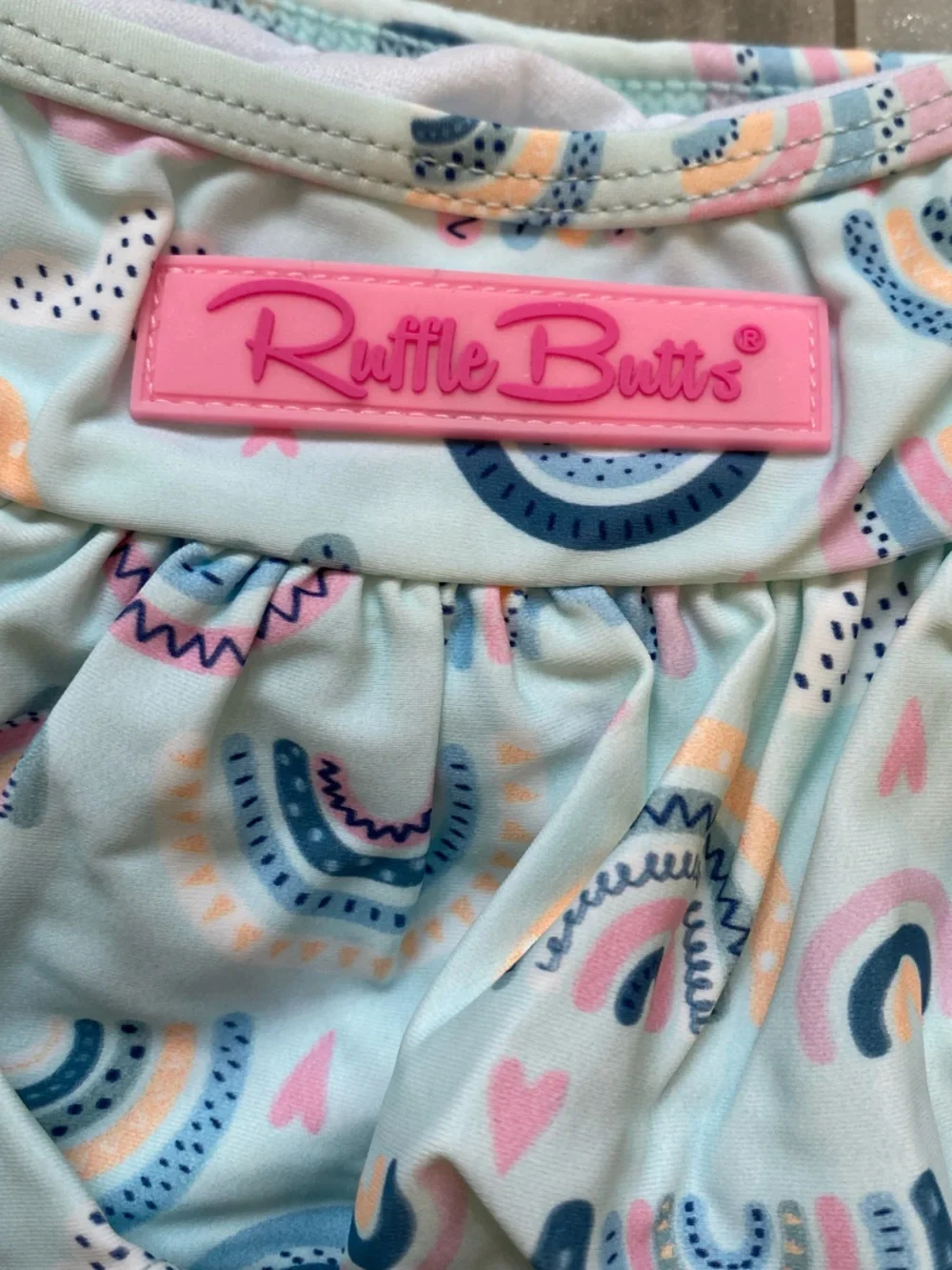NWT RuffleButts Pastel Chase the Rainbow Bow Top Skirted Bikini girls 18-24M